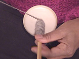 winding yarn on spindle